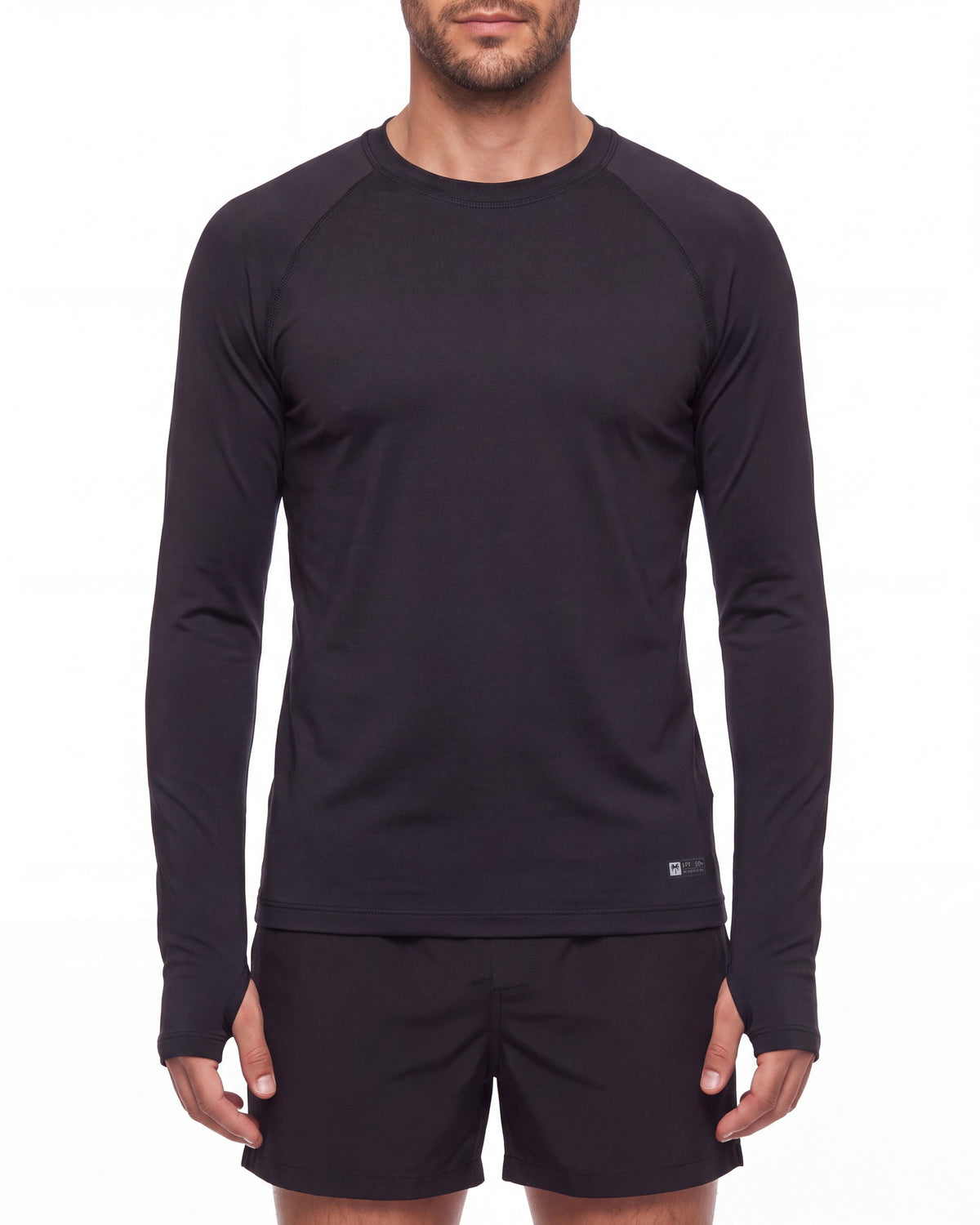 Torso de hombre con rashguard FIJI negro de manga larga y costuras planas